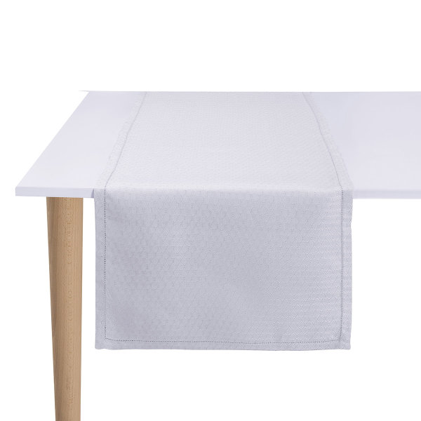 Chemin de table de Le Jacquard Français; Model Portofino Geo Bianco; Couleur principale blanc en lin; Taille 50x150 cm rectangulaire; Motif  Tissé