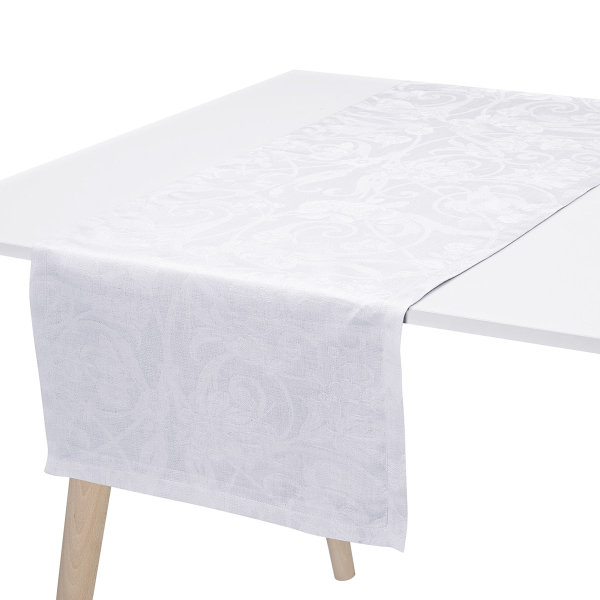 Camino de mesa de Le Jacquard Français; Modelo Tivoli Blanc; Color principal blanco en lino; Tamaño 50x150 cm rectangular; Motivo Celebraciones festivas en tejido jacquard