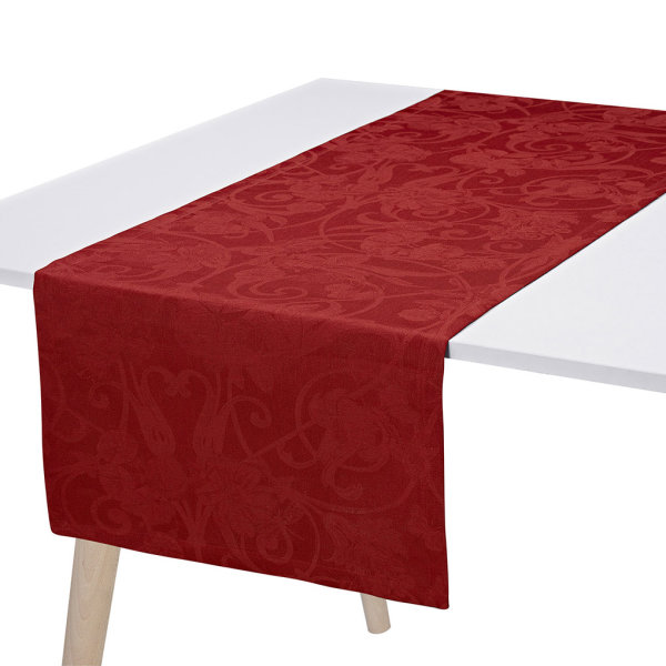 Tischläufer von Le Jacquard Français; Modell Tivoli Velours in Grundfarbe rot aus Leinen; Größe 50x150 cm rechteckig; Motiv festliche Anlässe; Muster jacquard-gewebt