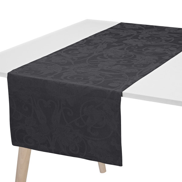 Chemin de table de Le Jacquard Français; Model Tivoli Onyx; Couleur principale noir en lin; Taille 50x150 cm rectangulaire; Motif Occasions festives tissé jacquard