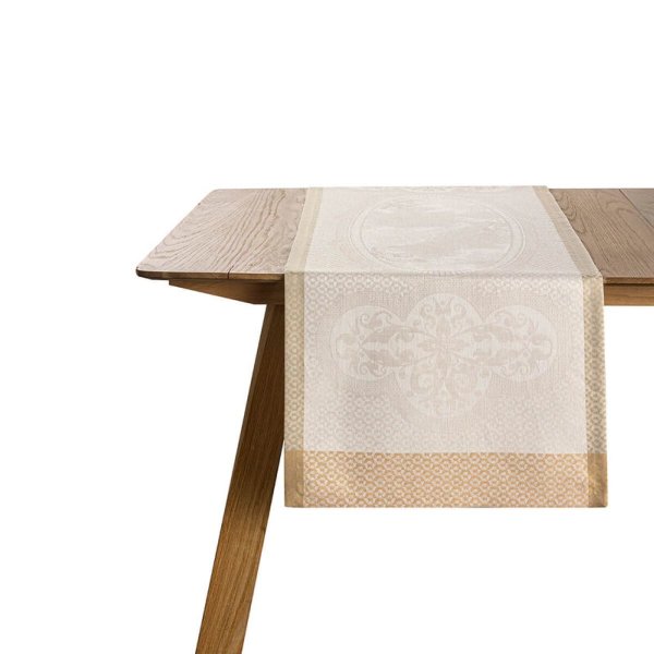 Table runner from Le Jacquard Français; Model Évasion Céleste Travertin; main colour beige in linen; Size 50x150 cm rectangular; Motif festive occasions; Pattern jacquard woven