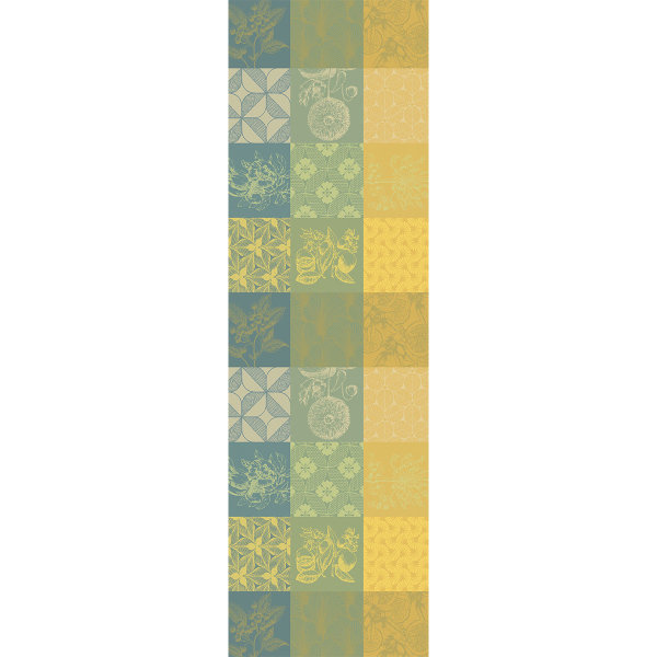 Table runner from Garnier-Thiebaut; Model Mille Parfums Limoni; main colour yellow in cotton; Size 55x180 cm rectangular; Motif Flowers and plants, graphic patterns; Pattern jacquard woven